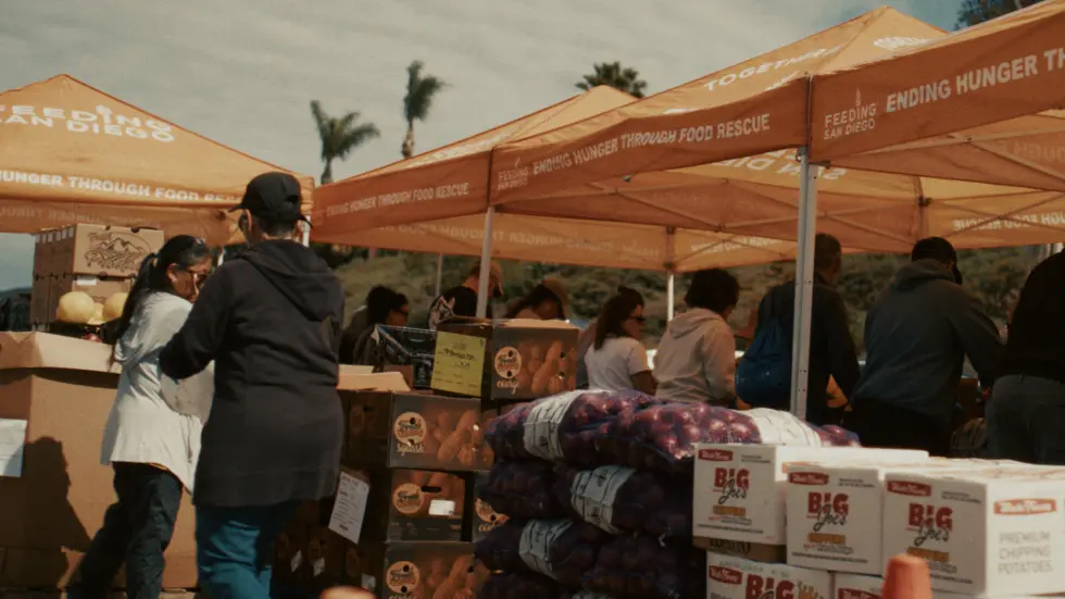 A San Diego family reviewing household costs